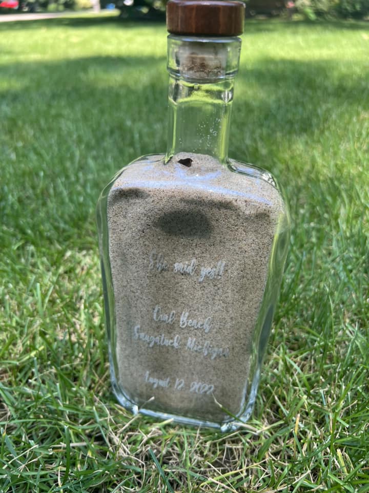 engraved glass bottle to commemorate an engagement